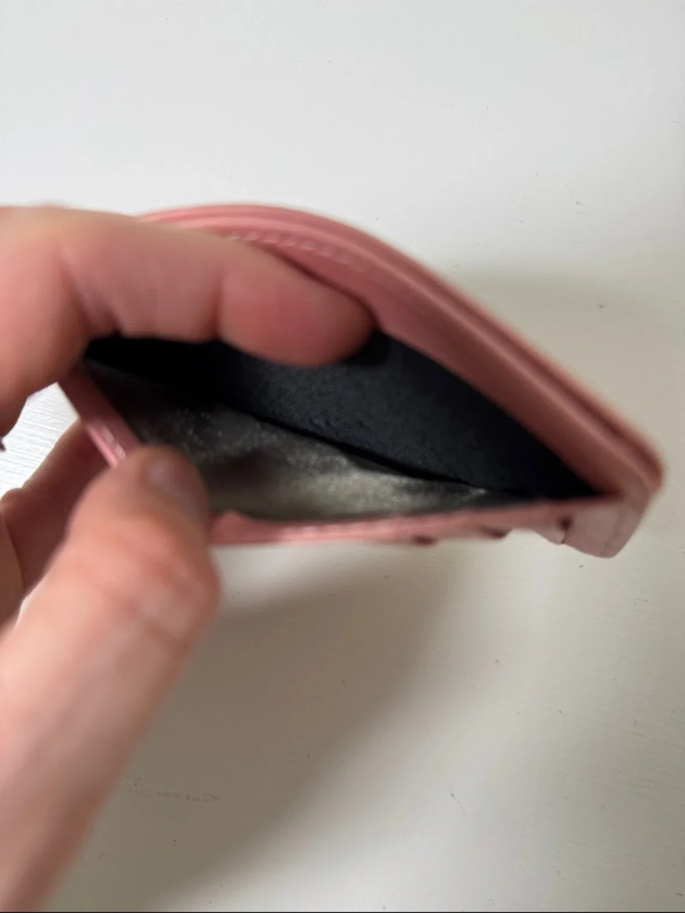 Pink card case.